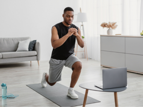 A man exercising on a mat