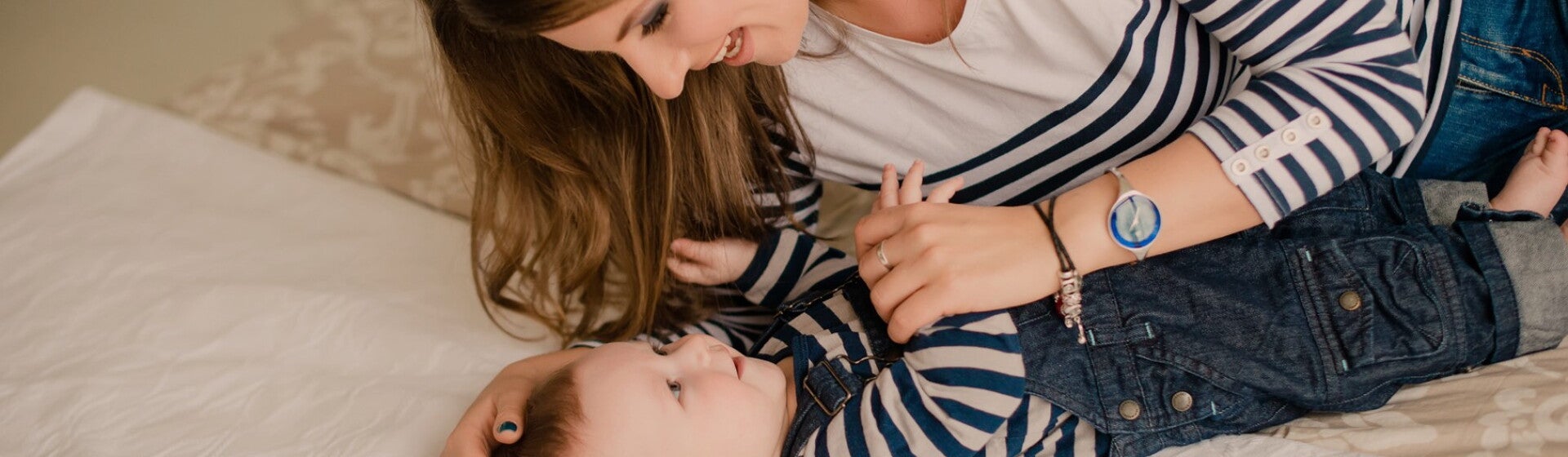 woman with baby lying on the floor