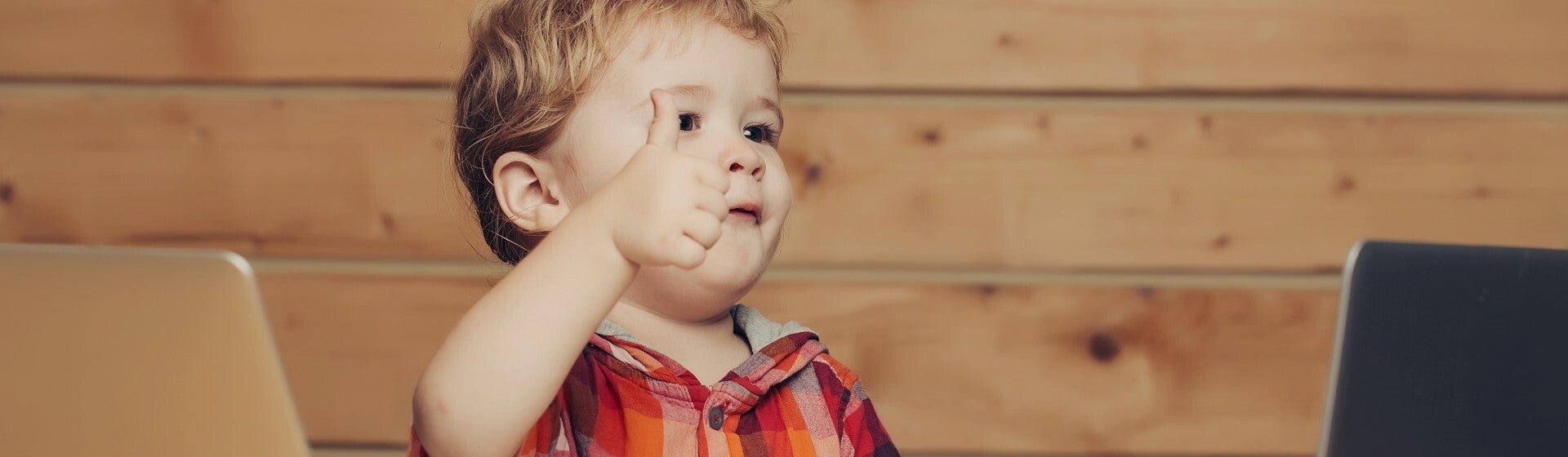 toddler with thumbs up