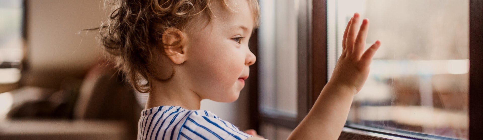 toddler looking out the window