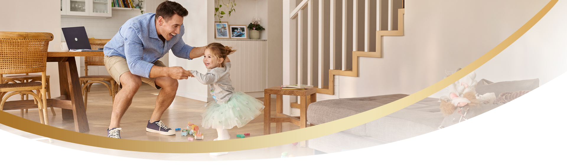 Dad dancing with toddler in house