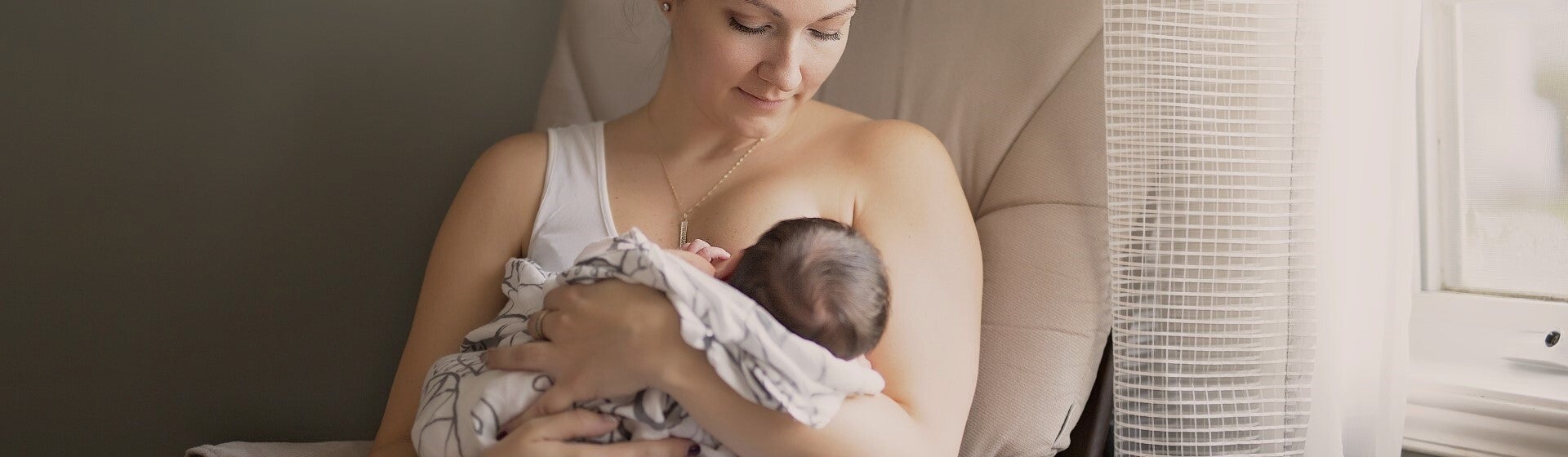 Mother breastfeeding her baby