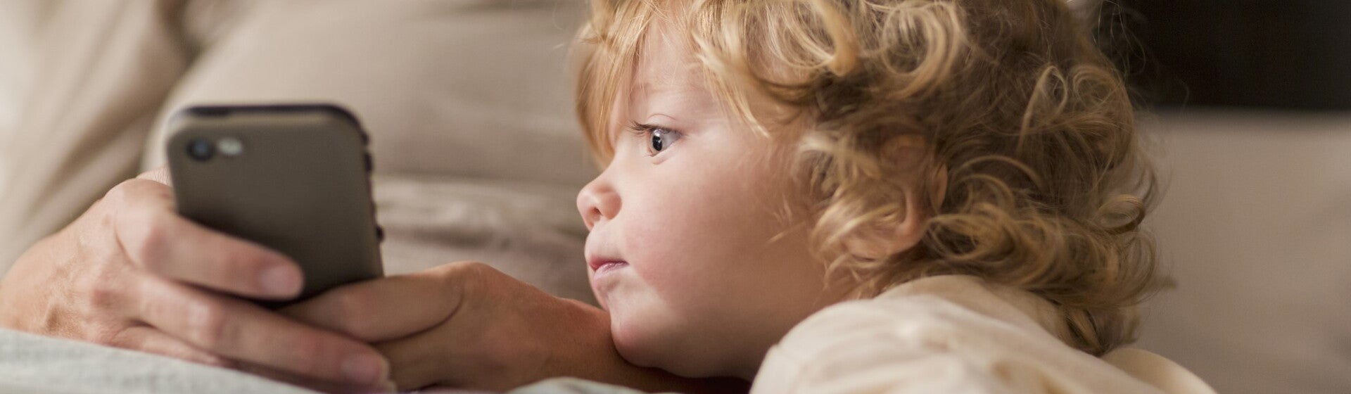 toddler looking at phone